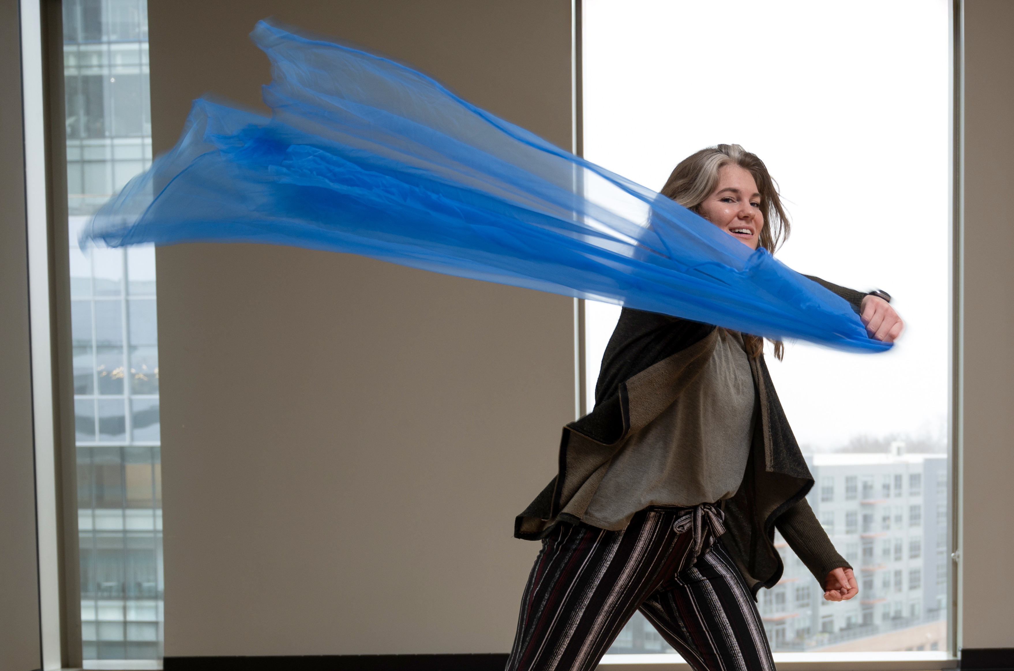 Genevieve Hargrove dancing with a blue scarf